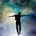 Silhouette of a woman jumping, starry night background