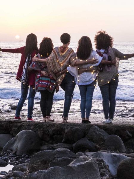 Love and friendship concept with group of female people enjoying the sunset on the ocean together - Love and friendship concept with group of female people enjoying the sunset on the ocean together -